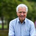 Portrait of Mr. David Lee, a senior citizen, enjoying a leisurely walk in a park