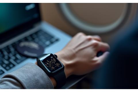 Executive checking their minimalist smartwatch for timezones during international travel.