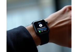 Smartwatch displaying encrypted message interface.